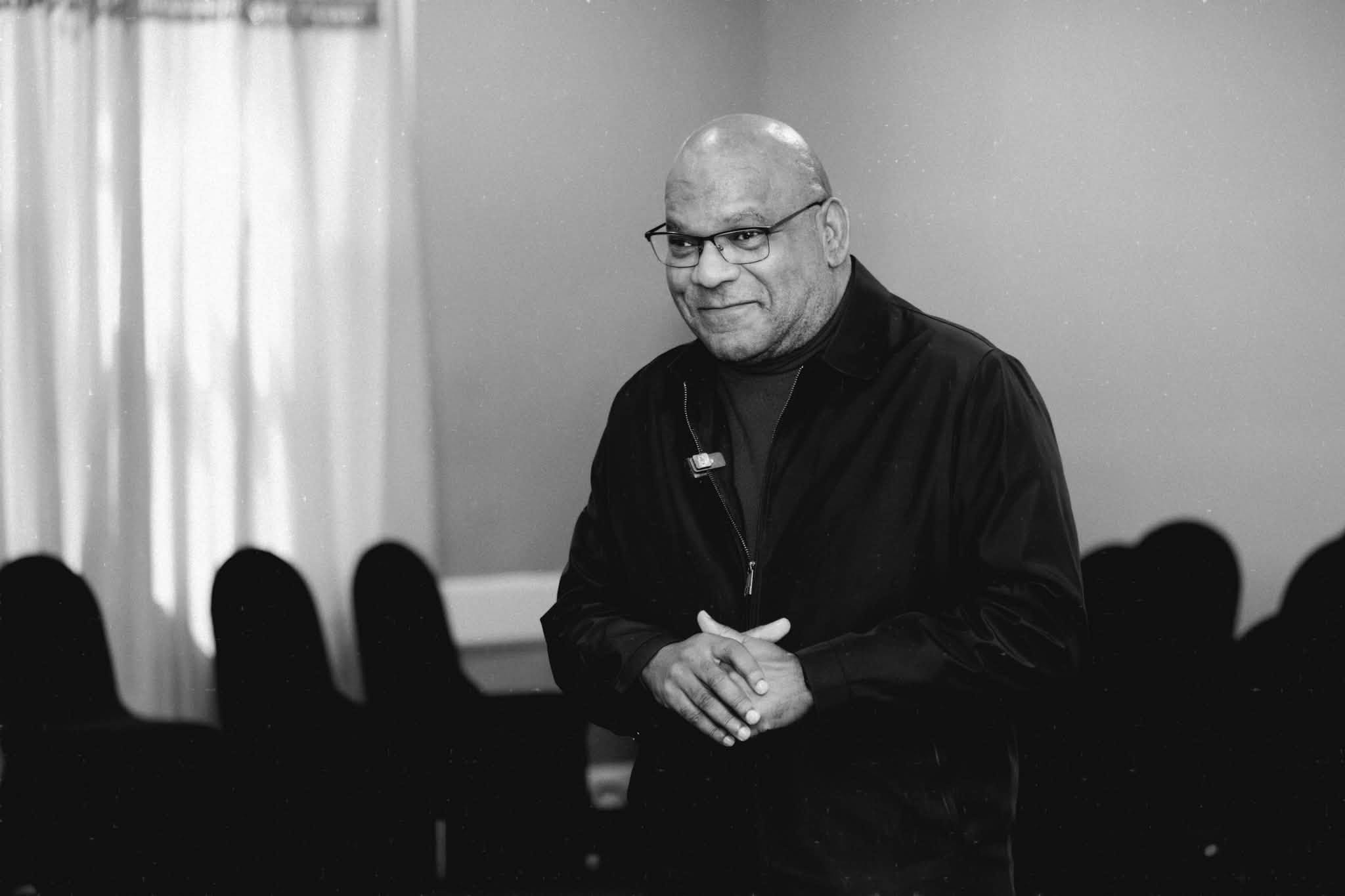 Apostle Stanford smiling, black and white