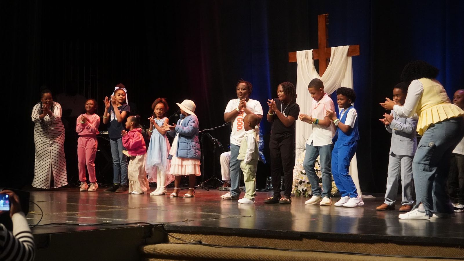 Children and youth leading worship together on the ICN stage